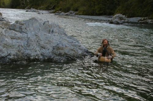 bofur riding down the pelorous river in a barrel